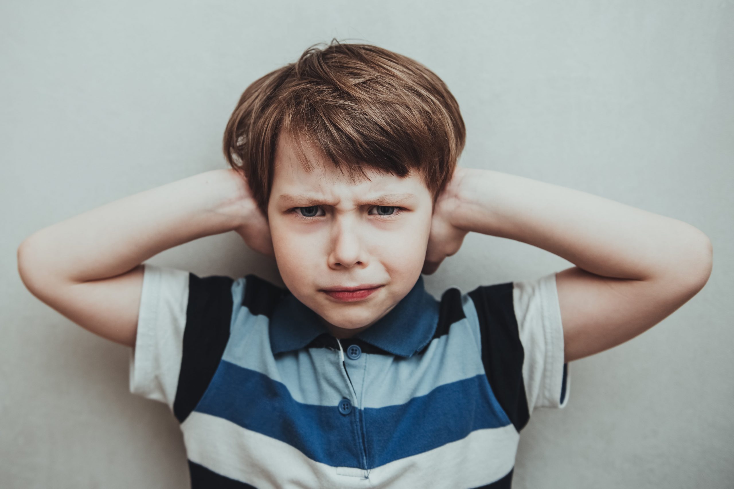 Child Boy Against Gray Background Covering Ears Wi 2022 01 20 00 57 26 Utc Min Scaled