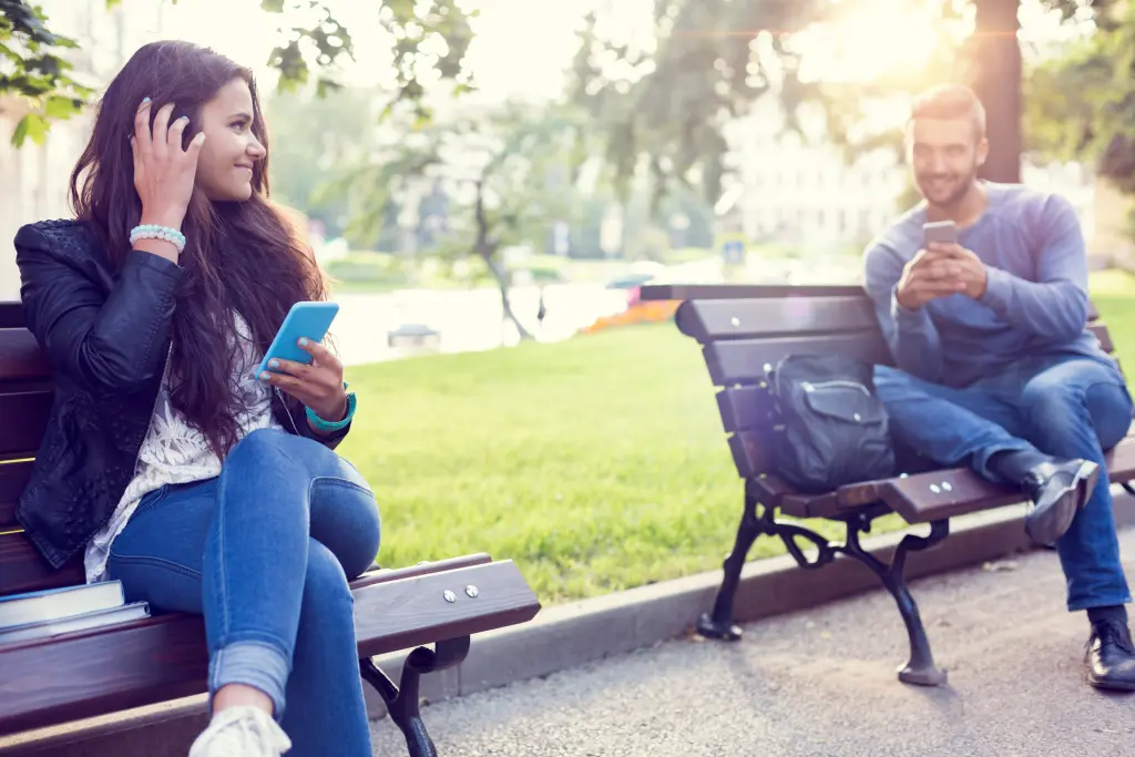 Happy Couple Using Smartphones City 55023539